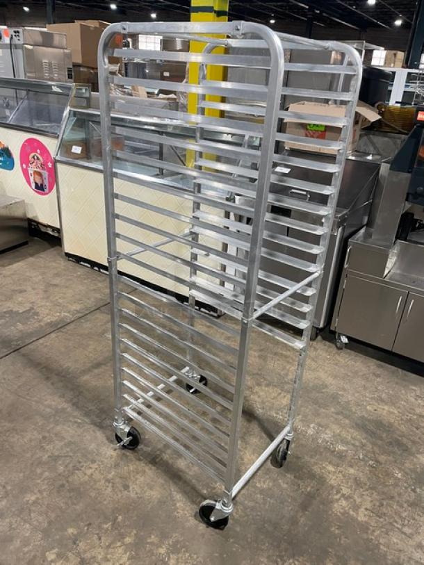 Commercial heavy-duty pan holding/transport rack on casters, aluminum, multiple shelf slots, used condition, ideal for kitchens.