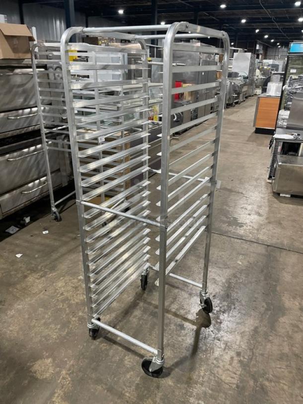 Commercial heavy-duty pan holding transport rack on casters, sturdy metal construction, multiple shelves, excellent condition.