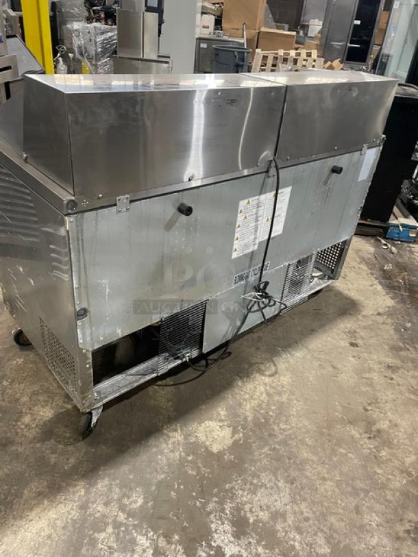 Turbo Air M3 Series stainless steel 2-door refrigerated prep table, model MST-60-24-N, with poly-coated rack, on casters.