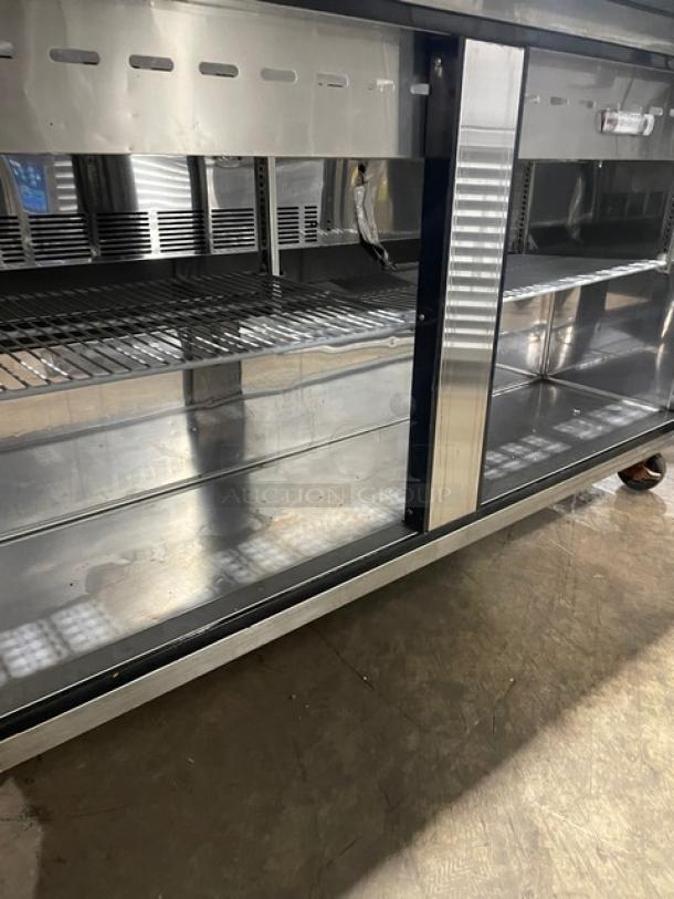 Turbo Air M3 Series 2-door refrigerated prep table, model MST-60-24-N, stainless steel, with poly coated wired rack, on casters.