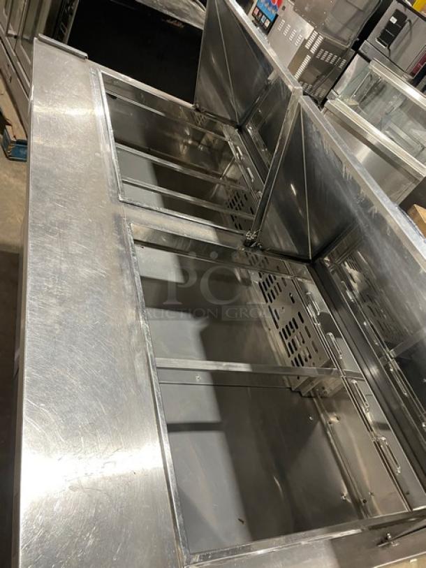 Turbo Air M3 Series stainless steel 2-door refrigerated prep table, Model MST6024N, on casters, with poly coated rack.