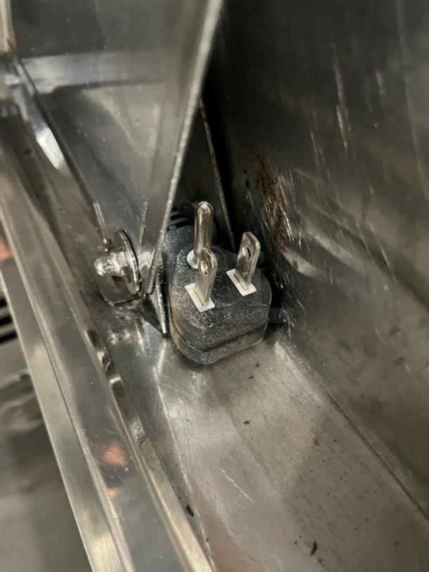 Turbo Air M3 Series MST-60-24-N power plug and socket detail in stainless steel casing, showing connection area.