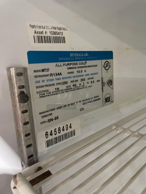 Beverage-Air MT27 commercial refrigerator; single glass door, poly-coated rack, model and serial labels visible.
