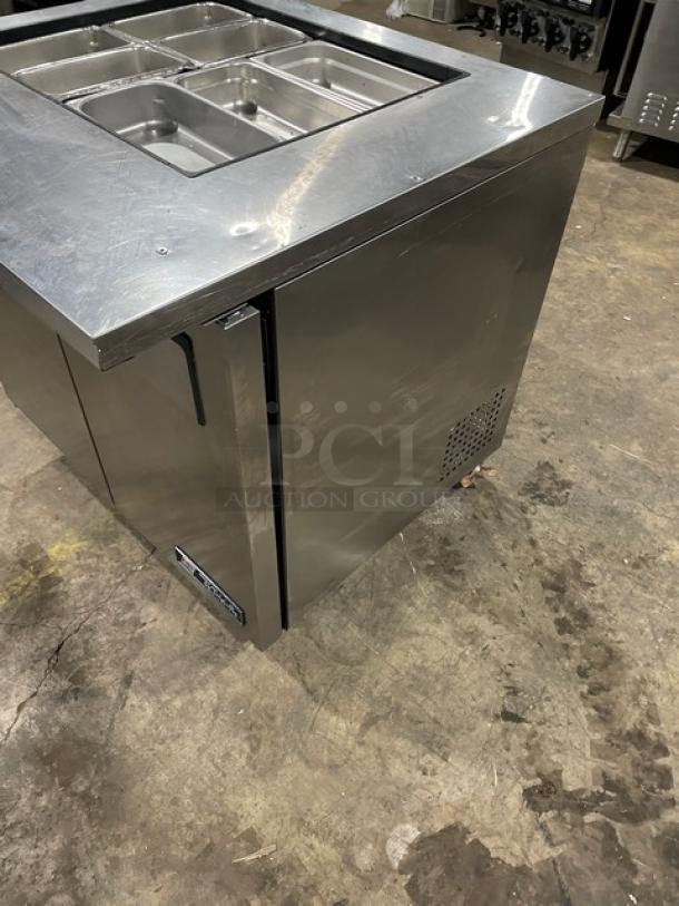 True TSSU-36-12M-B stainless steel 2-door refrigerated prep table, hotel pans, on casters, good condition.