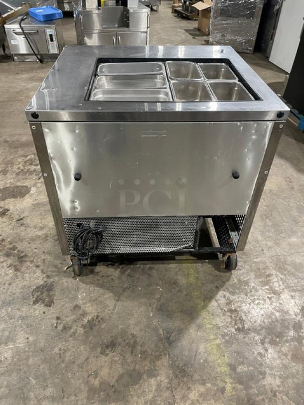 True TSSU-36-12M-B stainless steel 2-door refrigerated prep table with hotel pan, on casters, good condition.