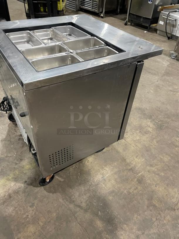 True TSSU-36-12M-B refrigerated prep table with 2 doors, stainless steel, hotel/steamtable pan, on casters, 115V, used condition.