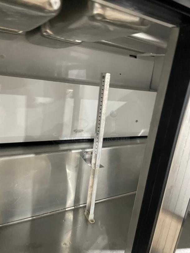 True TSSU-36-12M-B stainless steel refrigerated prep table. Features two doors, mega top with steam table pan, on casters.