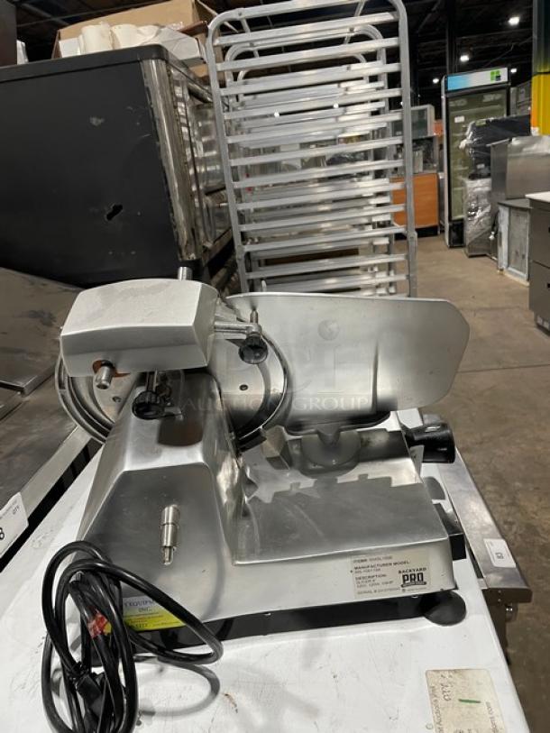 Backyard Pro 9" deli/meat slicer, model 554SL109E, electric-powered, countertop, 120V, good condition, on legs.