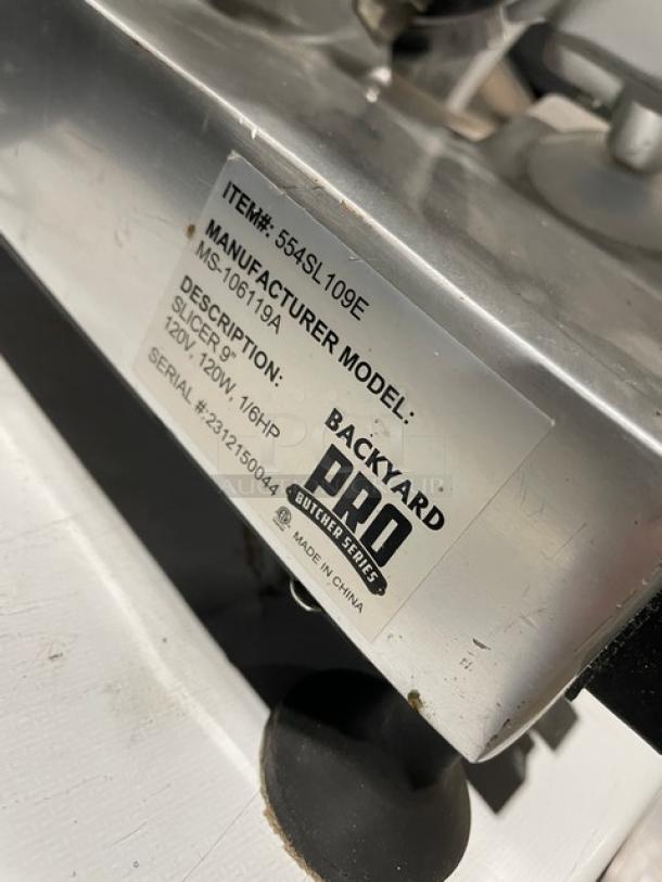 Backyard Pro Butcher Series 9" deli/meat slicer, model 554SL109E, 120V, on legs. Includes manufacturer's label.