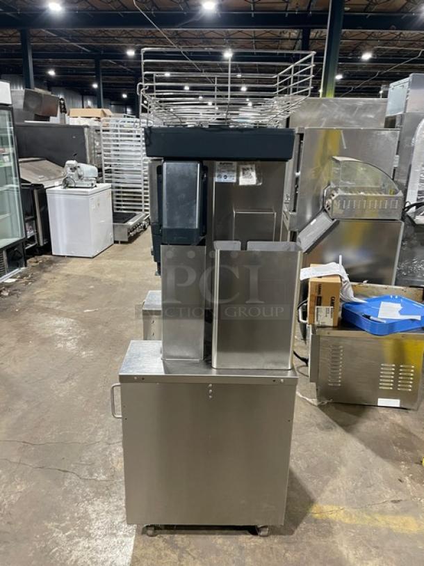 Zummo Z40CN commercial citrus juicer, stainless steel, with drip tray, on casters. Model: Z40C-N SN: 02227252AG, 110-120V.