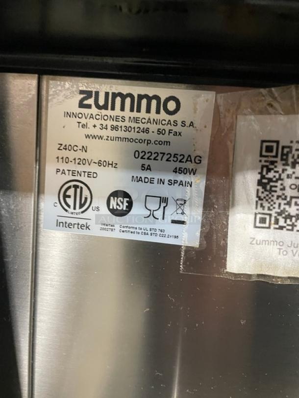 Zummo Z40C-N stainless steel commercial citrus juicer, ETL and NSF certified, 110-120V, with drip tray and casters.