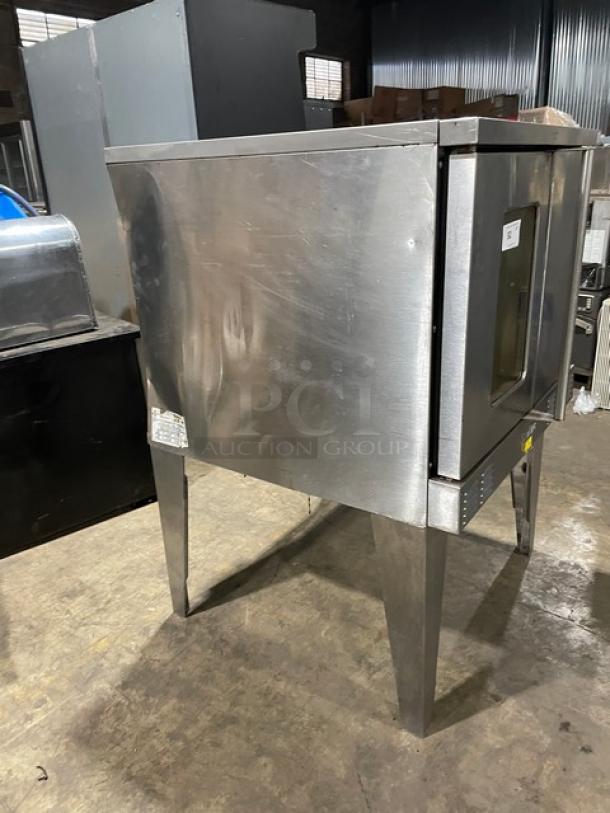 SunFire commercial stainless steel gas convection oven with wired rack, single stacked, on legs. Good condition.