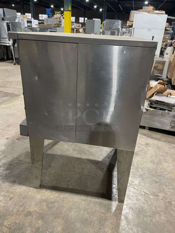 SunFire stainless steel gas-powered convection oven, single stacked, wired rack, on legs, visible wear.