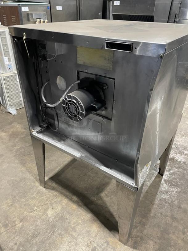 SunFire commercial stainless steel gas convection oven on legs, features a wired oven rack, well-maintained exterior.