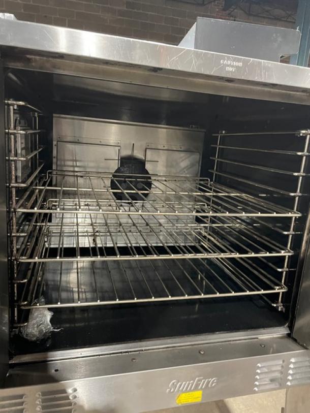 SunFire commercial stainless steel gas convection oven with wired rack, single-stacked design on legs, used condition.