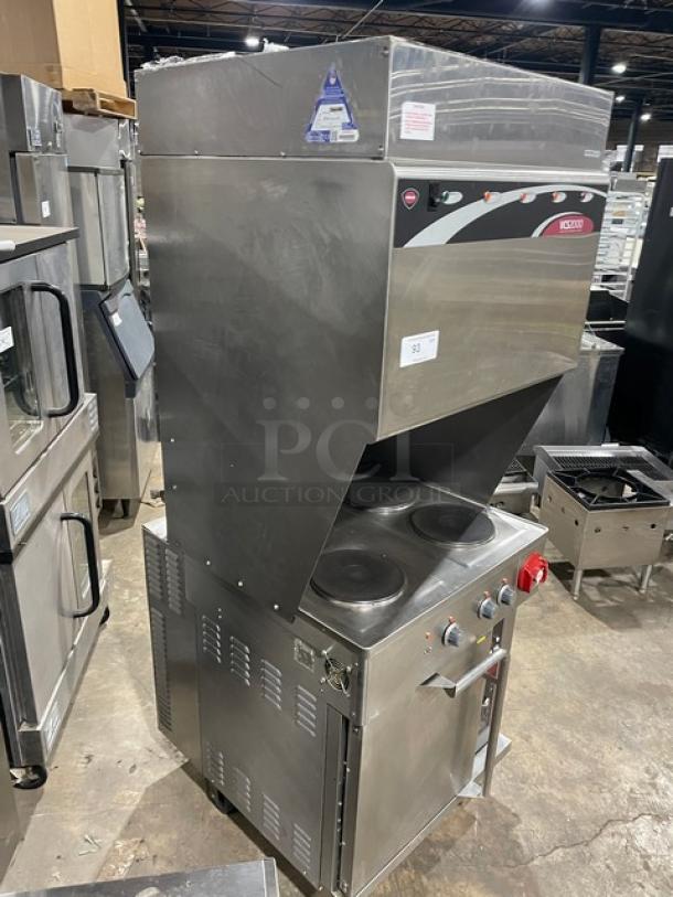 Wells VCS2000 commercial stainless steel electric ventless cooking system with 4-hot plate range, convection oven base, ansal system, wired oven rack, rear casters, and front legs. 208V.