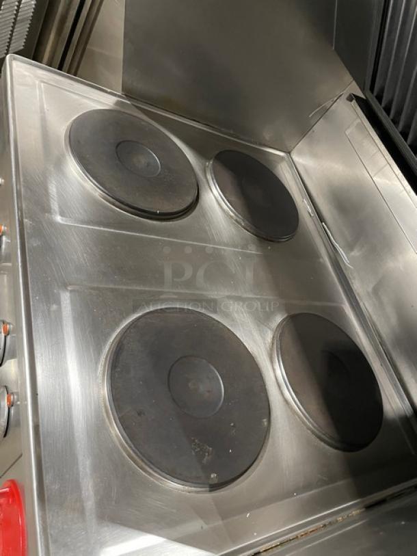 RARE Wells VCS2000 stainless steel ventless cooking system, 4-hot plate range, convection oven base, built-in Ansal system, wired oven rack, 208V, rear casters, front legs.