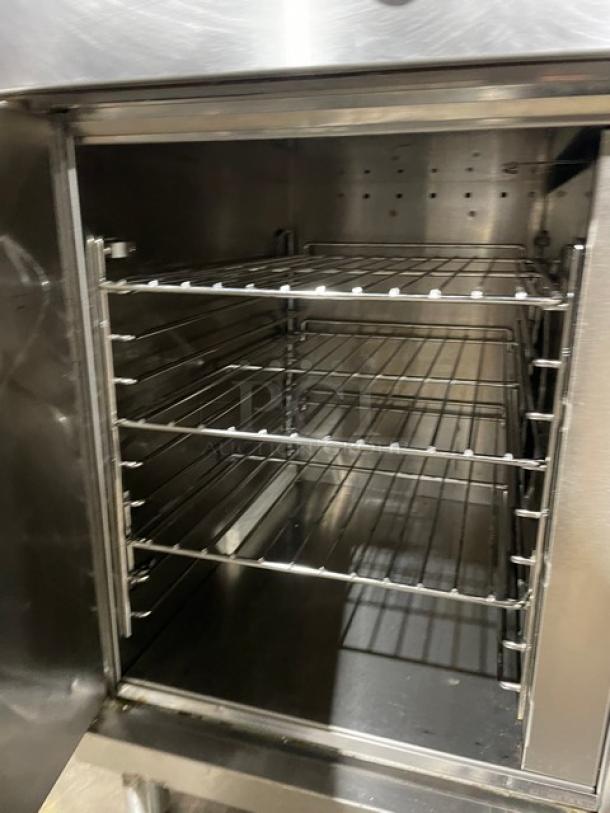 Wells VCS2000 stainless steel ventless cooking system with 4 French hot plates, convection oven base, and wired rack.