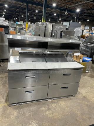 Delfield stainless steel 4-drawer refrigerated prep table, model UCD4464N12DD5, with overhead shelf and cutting board.