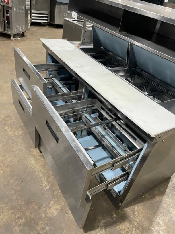 Delfield stainless steel 4-drawer refrigerated bain marie prep table, model UCD4464N-12-DD5, with overhead shelf and cutting board.