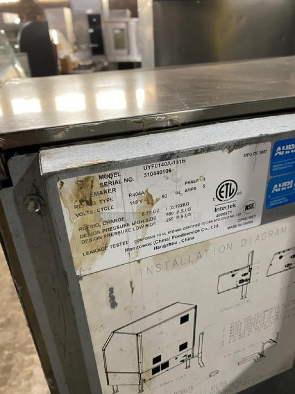Manitowoc NEO Series ice maker, model UYF0140A161B, stainless steel, air-cooled, undercounter, 115V, 1 phase. Serial: 310440106. Tags show specs and certifications.