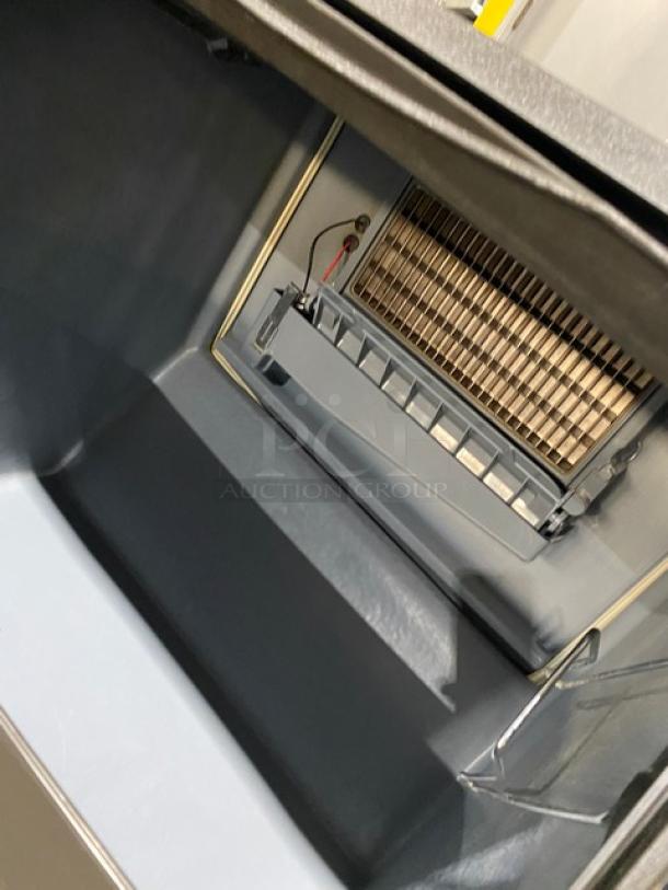 Manitowoc NEO Series ice maker, Model UYF0140A161B, half-dice cube style, stainless steel, 115V, air-cooled, on legs.