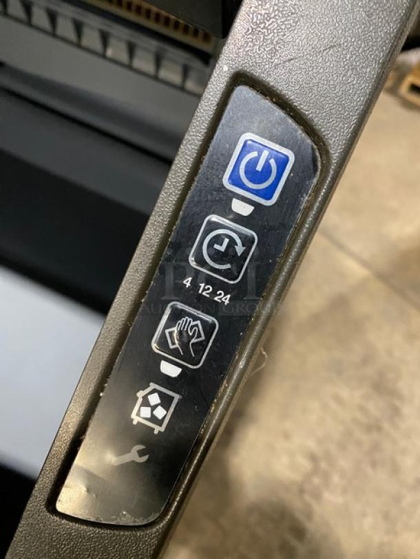 Control panel close-up of Manitowoc NEO Series Ice Machine Model UYF0140A161B, featuring power and timer buttons.