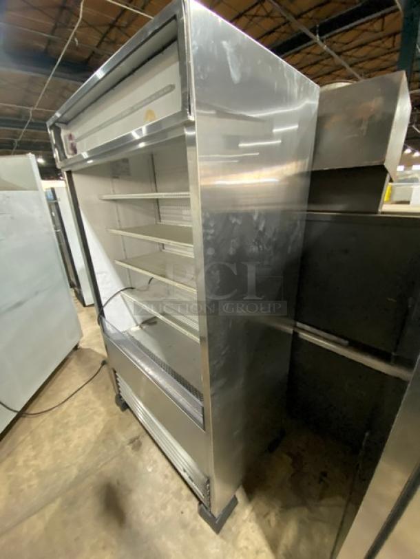 True TAC-48-LD stainless steel refrigerated display case, multi-tier, adjustable poly-coated racks, on legs, 208-230V, 1-phase.