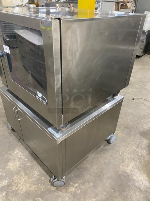 Rational SCCWE62G commercial stainless steel combi oven with 2-section pan stand, natural gas, full-size, on casters.