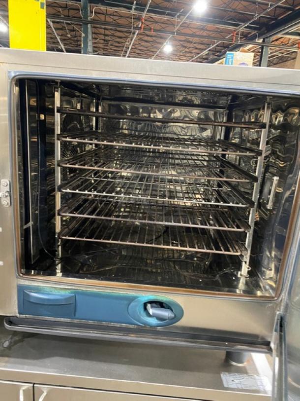 Rational SCCWE62G commercial combi oven, stainless steel, natural gas, full-size 6-pan, wired racks, on casters.