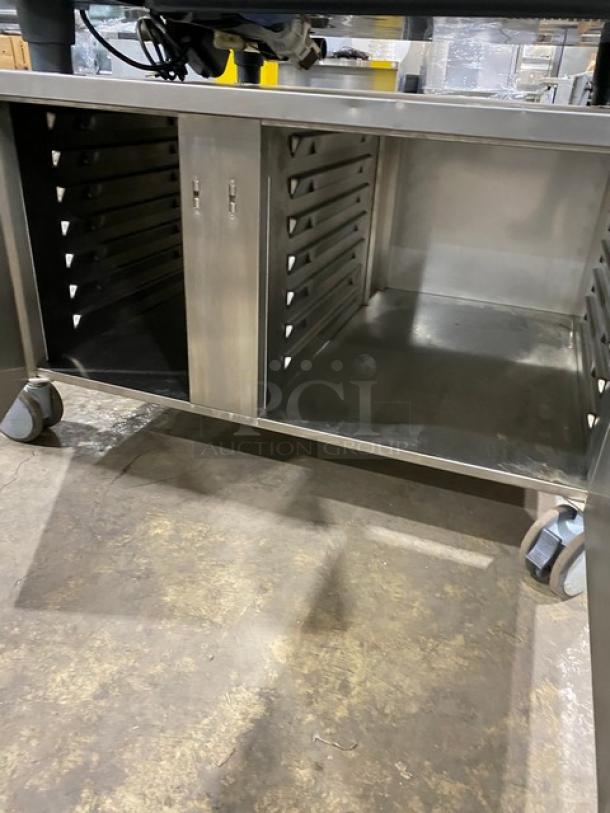 Rational SCCWE62G commercial combi oven on an enclosed 2-section pan cart, stainless steel, on casters.