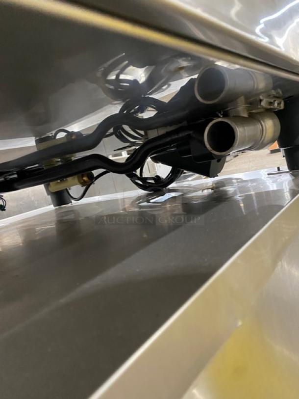 Rational SCCWE62G commercial stainless steel combi oven, natural gas powered, includes wired racks and 2-section pan stand.