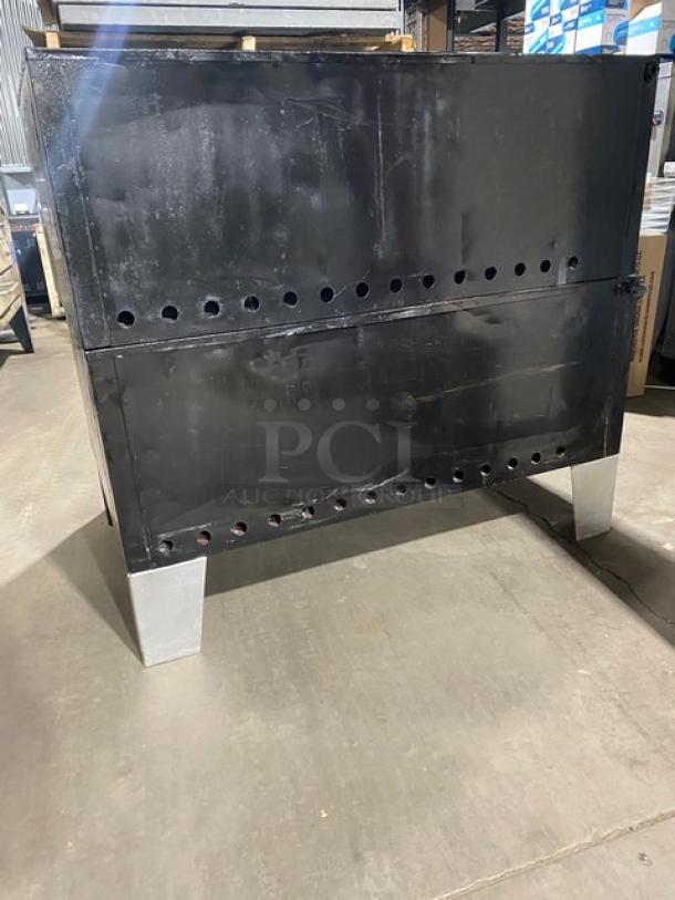 Bakers Pride commercial stainless steel double deck gas pizza oven on legs, SN: 5732. Suitable for 6 pies, with stone decks.