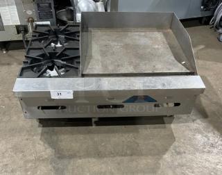 Comstock-Castle FHP3624 stainless steel countertop 2-burner split top griddle range, with back & side splash, on legs.