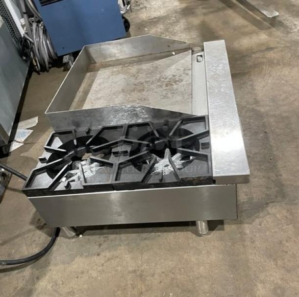 Comstock-Castle FHP3624 stainless steel 2-burner griddle range, natural gas, countertop model with back and side splash, on legs.