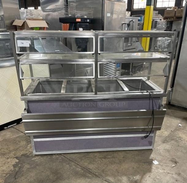 Atlas Metal stainless steel refrigerated 4-well salad bar with sneeze guard, tray slide, and enclosed storage. Model WCM-BT-4 on casters.