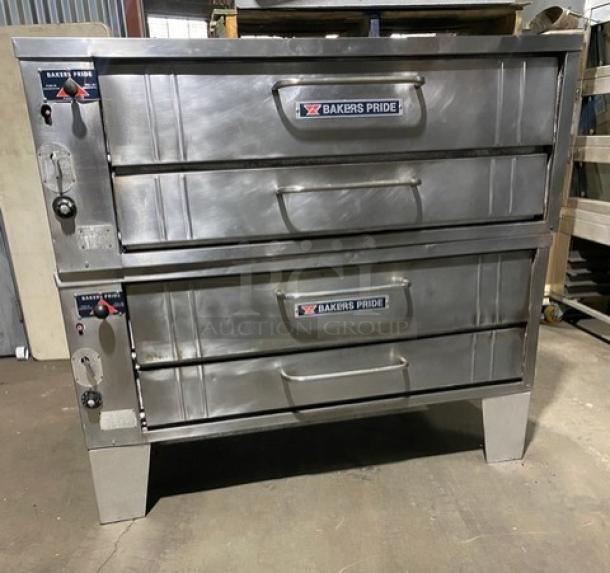 Bakers Pride stainless steel gas-powered double-deck pizza oven, 6-pie capacity, with stones, SN: 5732, on legs.
