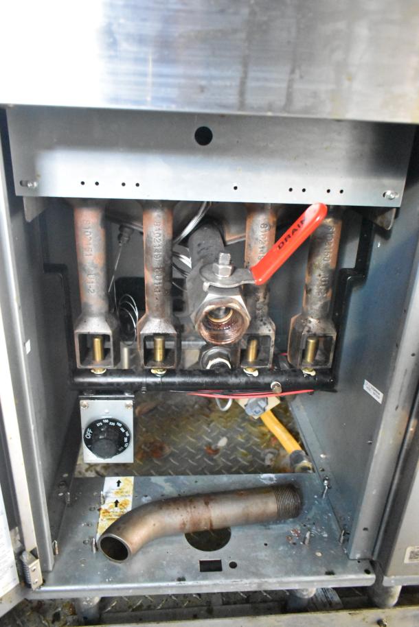 Interior view of Cruising Kitchens 24' food trailer showcasing commercial-grade kitchen plumbing and hardware components.