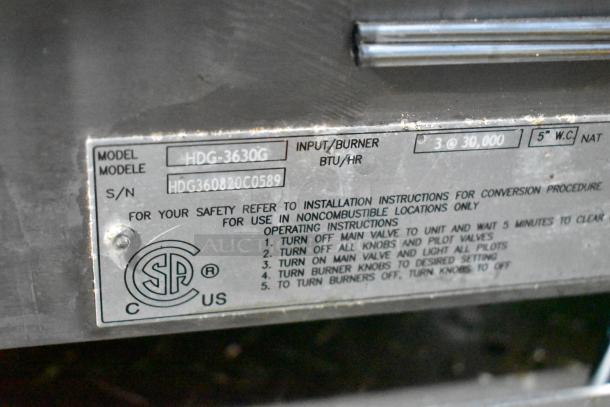 ```alt text
Label of Cruising Kitchens food trailer equipment, showing model HDG-3630G, input 3 at 30,000 BTU/HR.
```