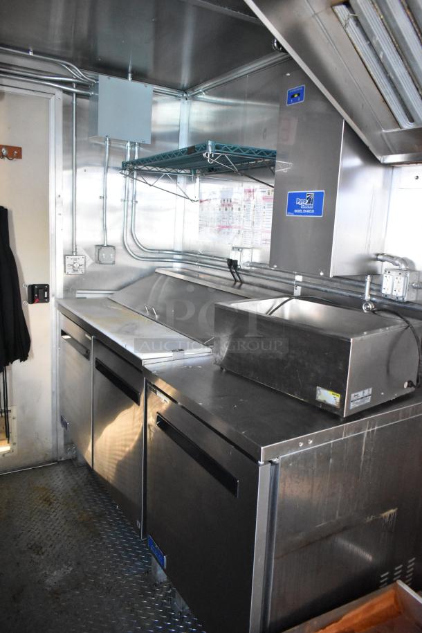 Cruising Kitchens 24' food trailer with Pyrochem hood and Arctic Air coolers. Equipped for various concepts, mint condition.