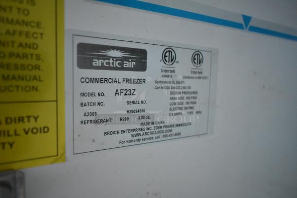 Label on Arctic Air Commercial Freezer, model AF23Z, details design pressure, refrigerant type, and warranty info.