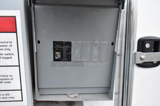 Electrical breaker panel in 24' Cruising Kitchens food trailer. Features dual 30-amp breakers. Ready for mobile kitchen operations.