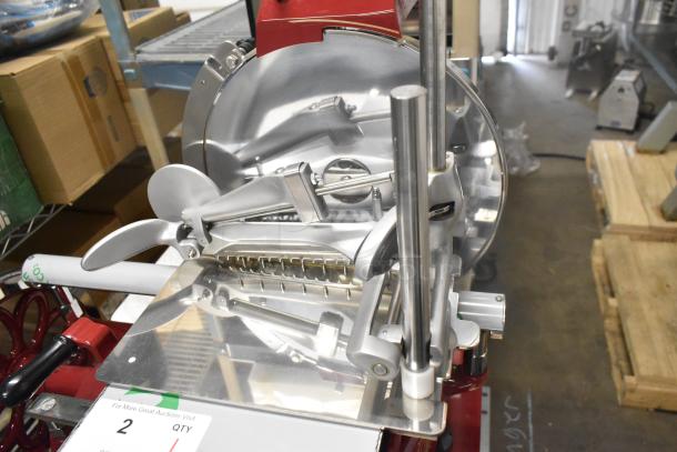 BRAND NEW Globe metal commercial flywheel meat slicer with blade, polished finish, model details visible, in mint condition.