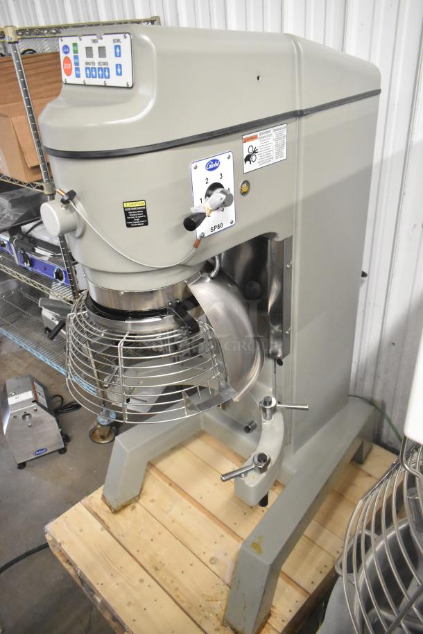 BRAND NEW Globe SP80 commercial 80-quart dough mixer with bowl guard, 220V, 3-phase, shown on wooden pallet.
