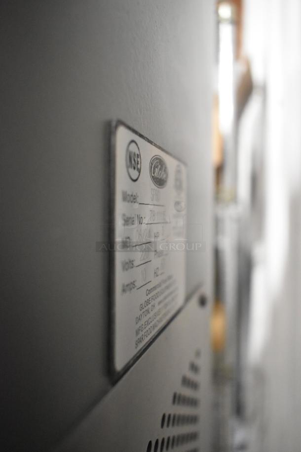 Label on Globe SP80 Metal Commercial Dough Mixer stating model, serial number, 220V, 3-phase, and manufacturer info.