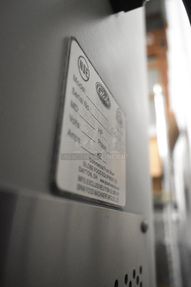 Brand new Globe SP80 dough mixer label, 220V, 3 phase, shows model, serial number, and manufacturing details.