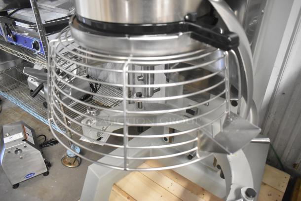 Brand new Globe SP80 commercial 80-quart dough mixer with bowl guard, 220V, 3-phase. Features metal construction.