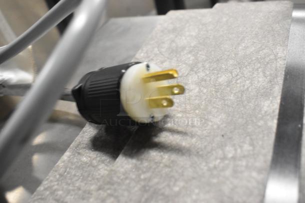 Close-up of a power plug for the Varimixer V20K planetary dough mixer, showing a three-prong design, brand new condition.