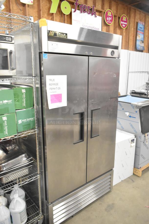 True T-35 stainless steel commercial 2-door reach-in cooler, 115 volts, 1 phase. Label reads: True, Refrige, Item#: T-35.
