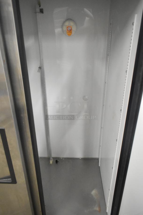 True T-35 stainless steel 2-door commercial cooler, 115 volts, 1 phase. Clean interior, shelving brackets visible.